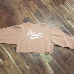 Peach colored graphic sweatshirt